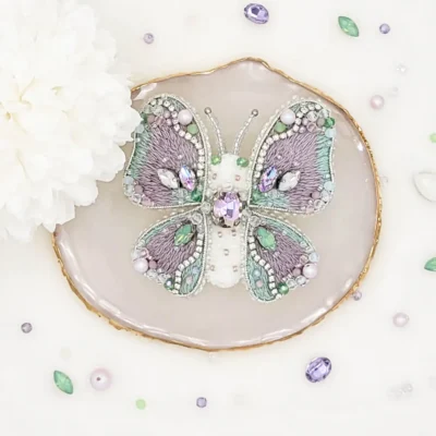 Handmade butterfly brooch pin by Fae Fancies, in green and purple color, Dreamy collection, silk velvet, hand-embroidery, front side