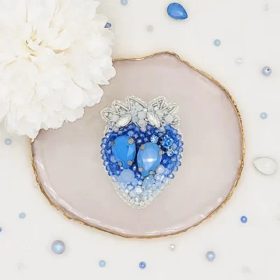 strawberry brooch by Fae Fancies in blue color, icy collection, front side