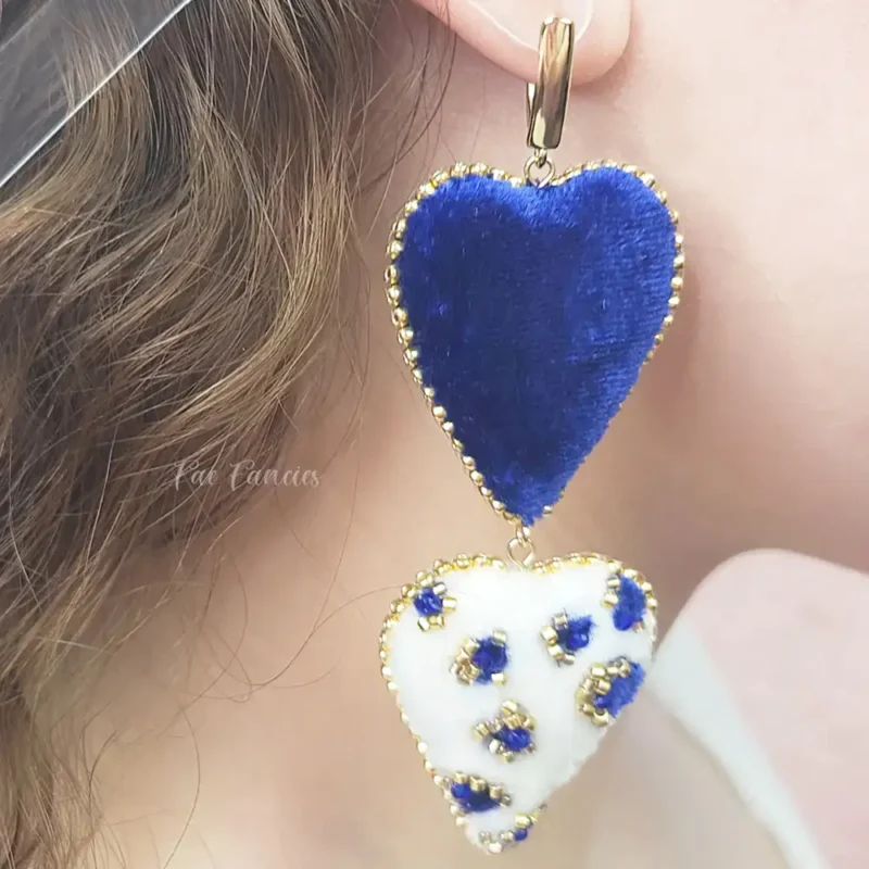 Handmade beaded heart earrings by Fae Fancies in blue and ivory color, animal print, silk velvet, Flirty Collection, model showcase