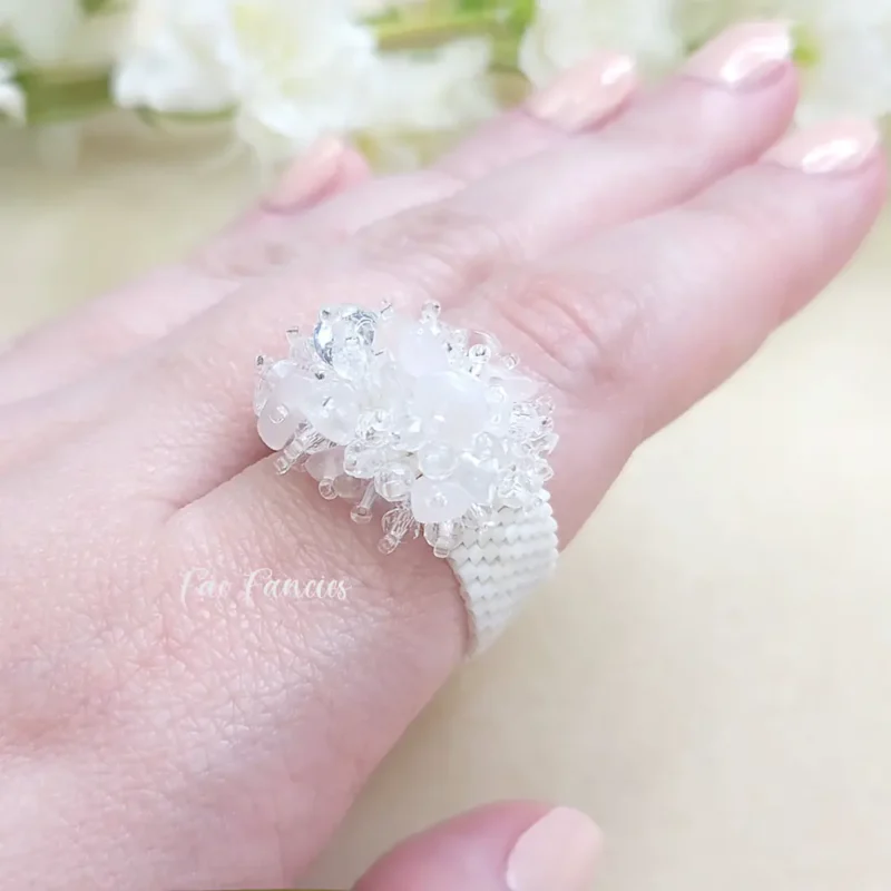 handmade beaded ring with natural gemstones, premium Japanese seed beads and faceted glass beads by Fae Fancies, Frilly Collection, rose quartz and clear quartz, hand showcase